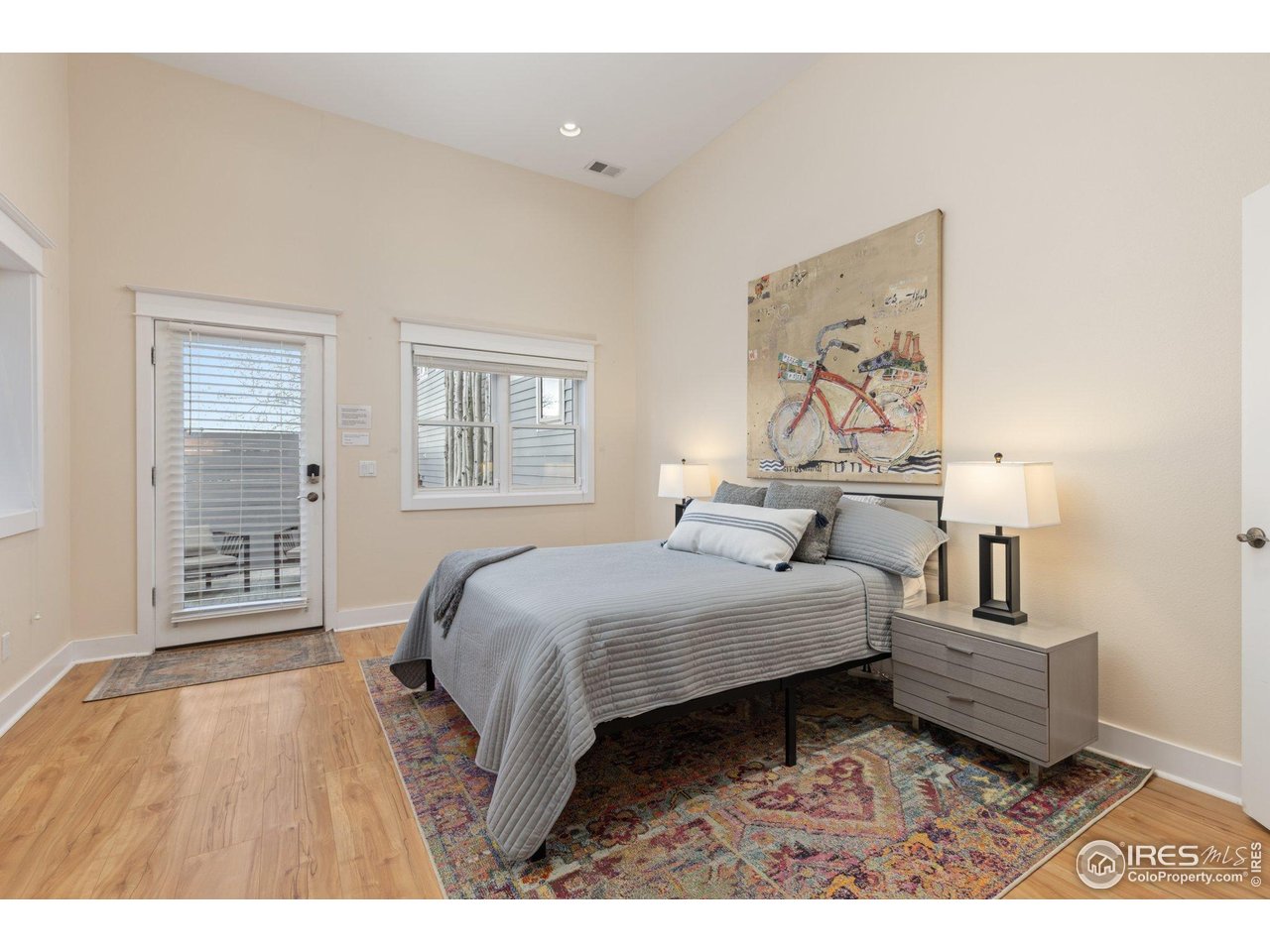 2942 4th Street Boulder, CO 80304 - Photo 26 of 40 a bedroom with a bed and a painting on the wall