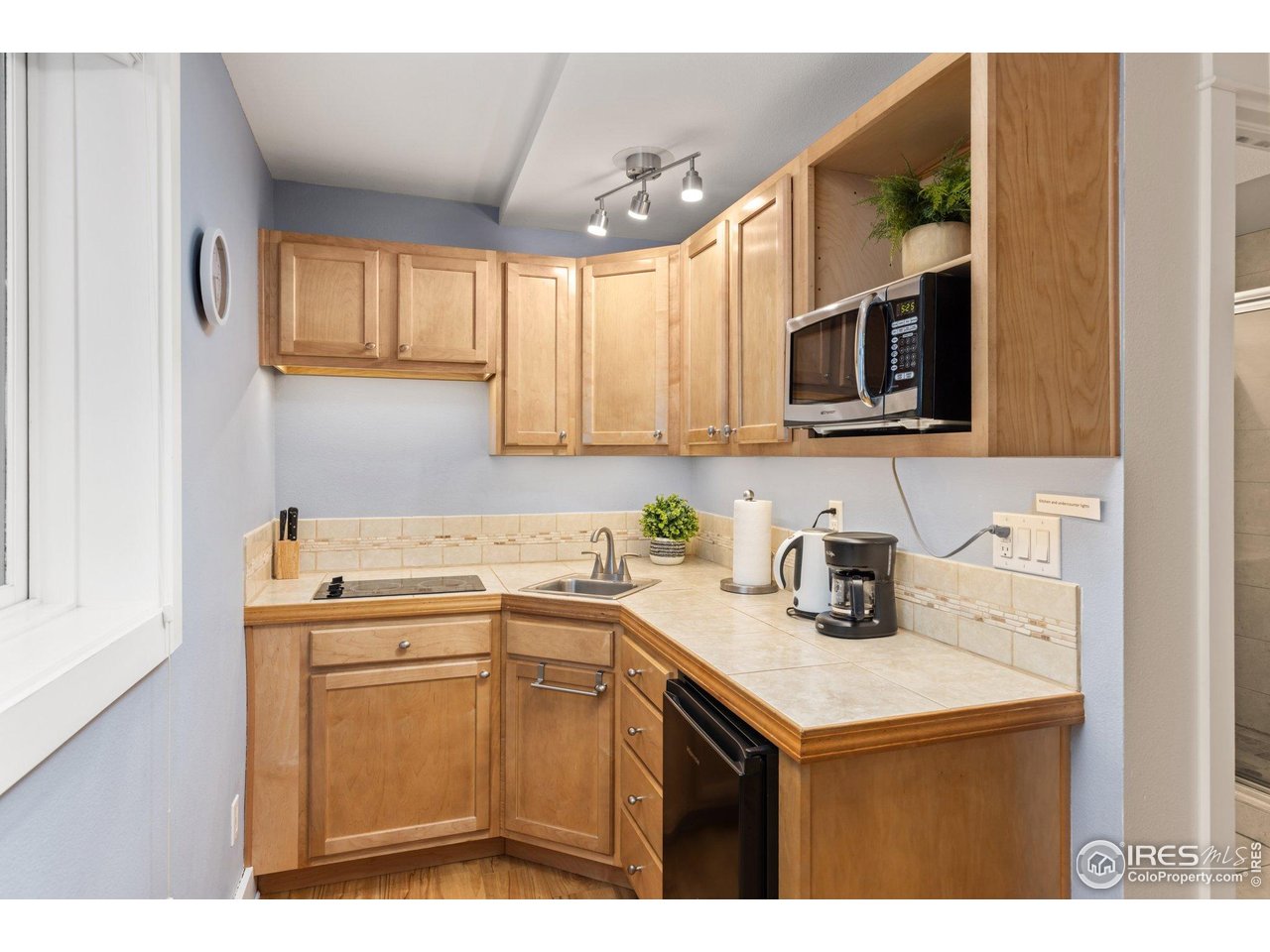 2942 4th Street Boulder, CO 80304 - Photo 28 of 40 a kitchen with a sink a stove and cabinets
