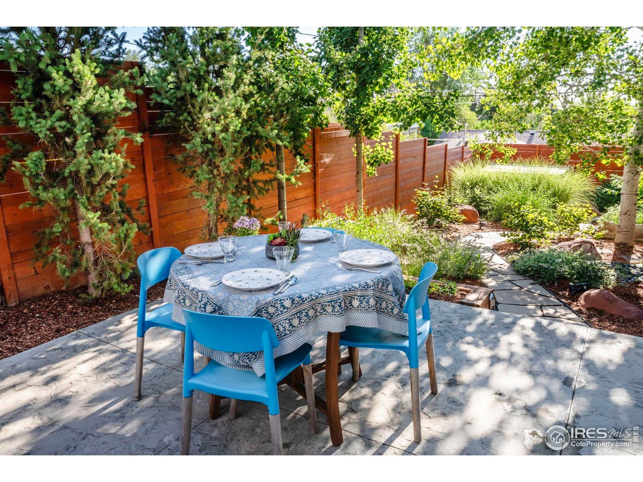 2942 4th Street Boulder, CO 80304 - Photo 31 of 40 a view of a backyard with table and chairs