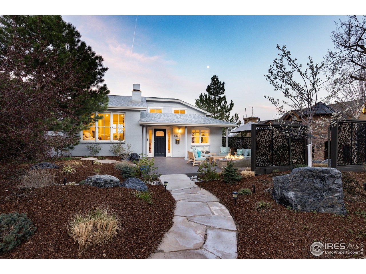 2942 4th Street Boulder, CO 80304 - Photo 32 of 40 a front view of a house with a yard