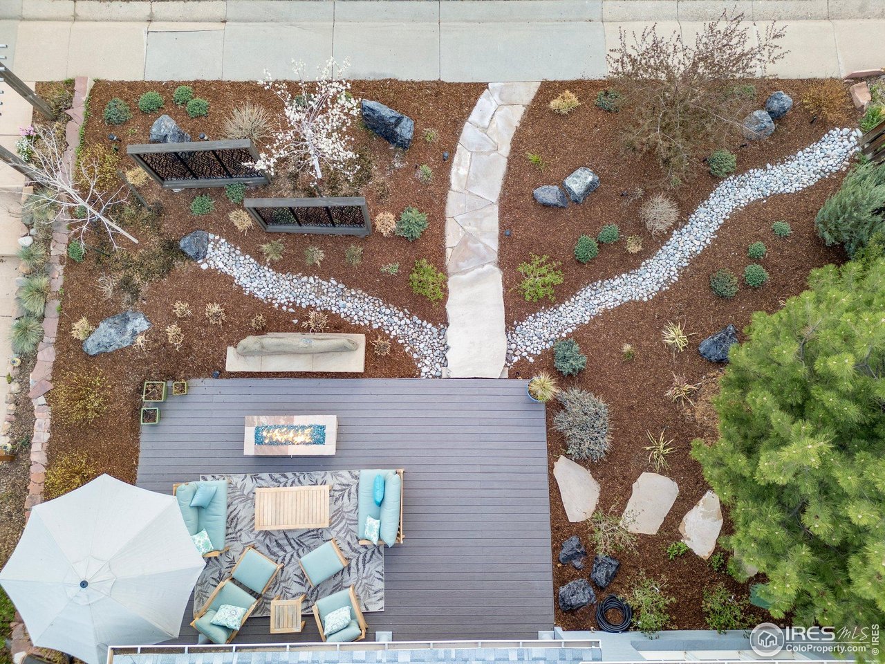2942 4th Street Boulder, CO 80304 - Photo 35 of 40 a view of a brick house with a bench