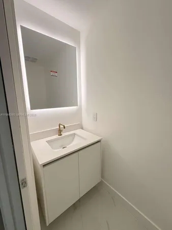 a bathroom with a sink and vanity