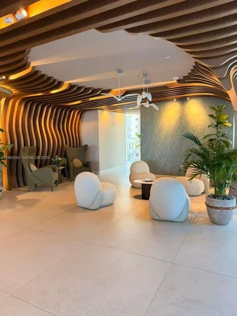 a view of a bedroom with wooden floor and a window