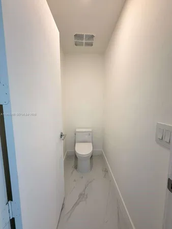 a bathroom with a toilet
