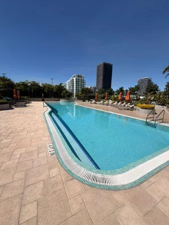 a view of an empty room and wooden floor