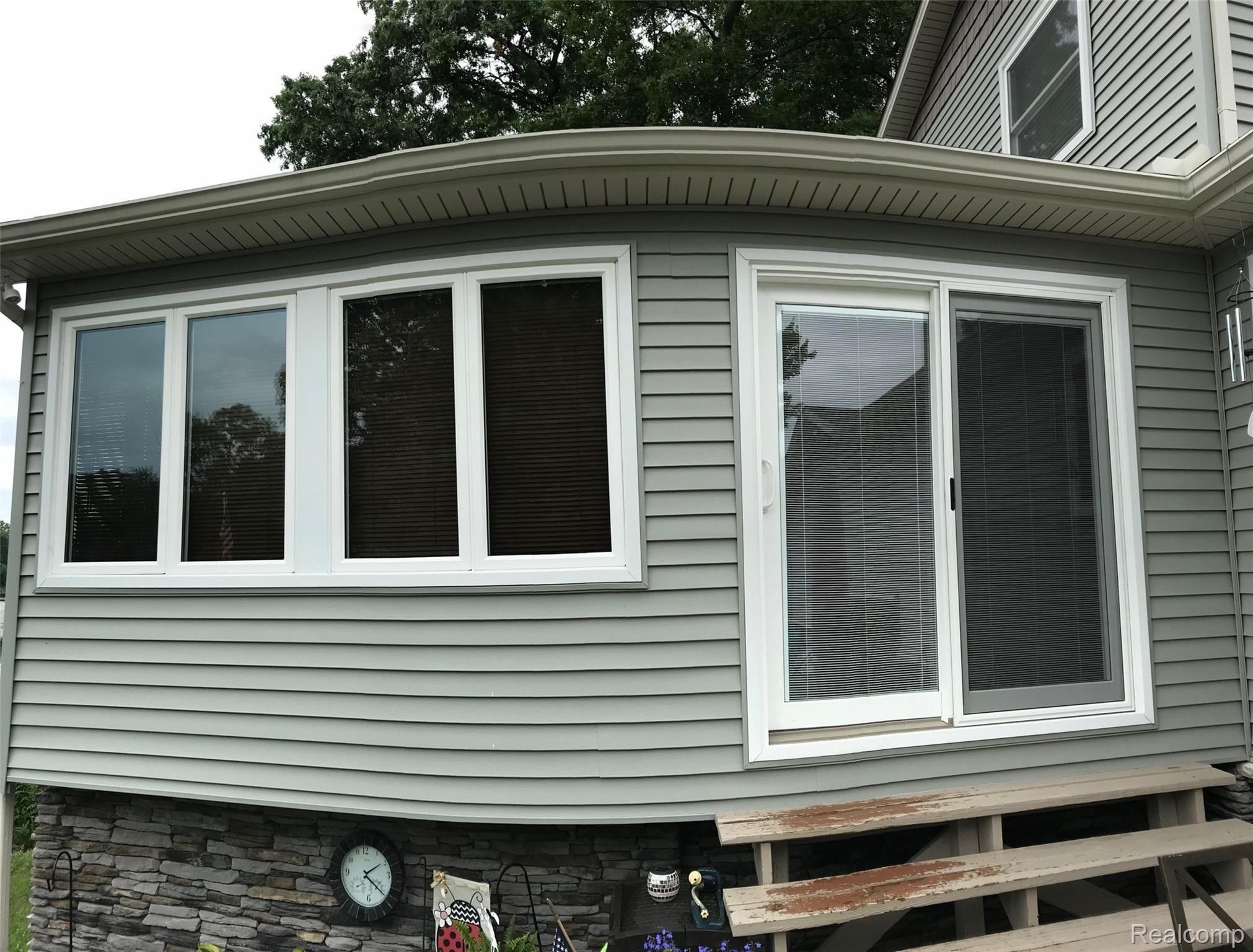 1480 Clark Lake Road Brighton, MI 48114 - Photo 13 of 36 New windows and Door wall throughout the home in 2015