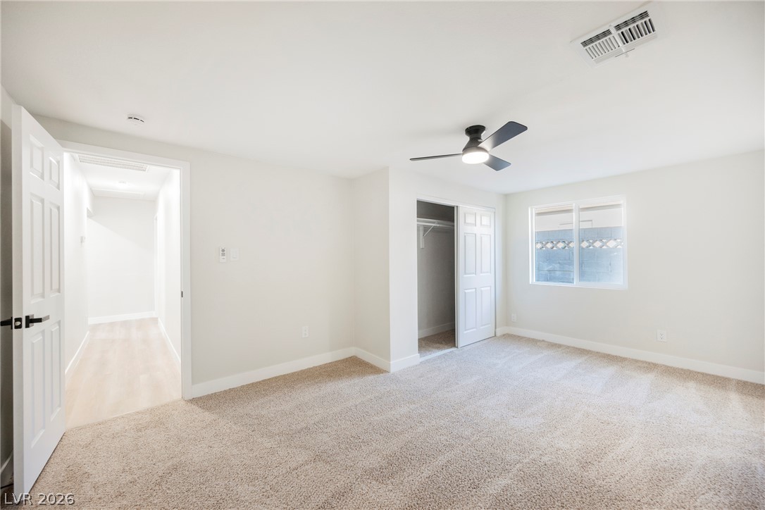 223 West Basic Road Henderson, NV 89015 - Photo 17 of 19 Plush carpeting and a built-in closet define this comfortable secondary bedroom space.