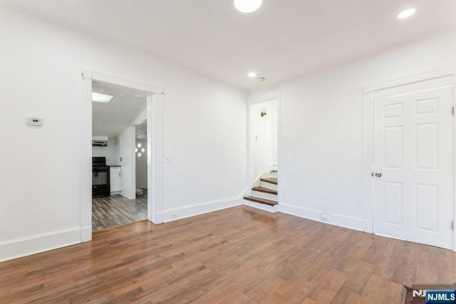 21 Central Avenue Tenafly, NJ 07670 - Photo 14 of 22 an empty room with wooden floor and windows