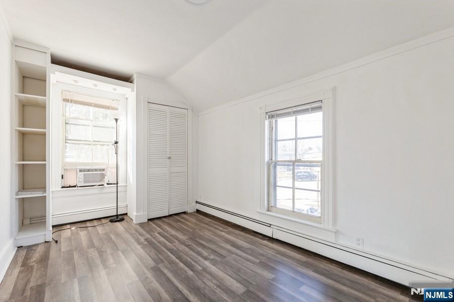 21 Central Avenue Tenafly, NJ 07670 - Photo 17 of 22 an empty room with wooden floor closet and windows