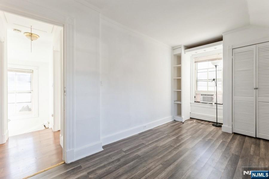 21 Central Avenue Tenafly, NJ 07670 - Photo 18 of 22 a view of an empty room with wooden floor and a window