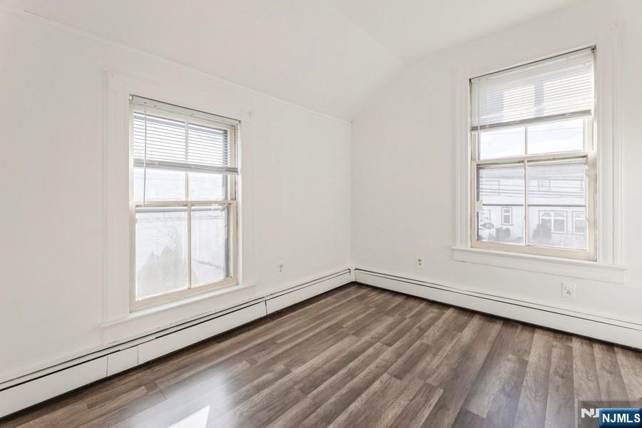 21 Central Avenue Tenafly, NJ 07670 - Photo 20 of 22 an empty room with wooden floor and windows