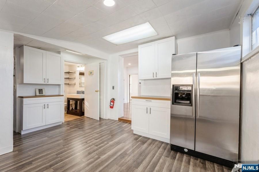 21 Central Avenue Tenafly, NJ 07670 - Photo 8 of 22 a kitchen with a refrigerator a sink and cabinets