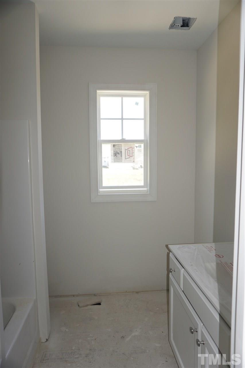 1508 Old Watkins Road Raleigh, NC 27616 - Photo 22 of 26 an empty room with windows
