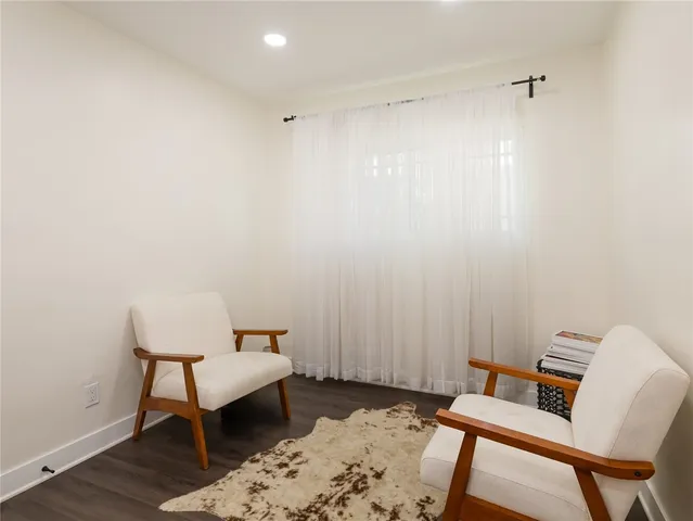 a hallway with a desk and chair