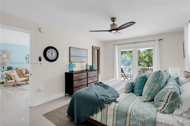 a bedroom with bed and a window