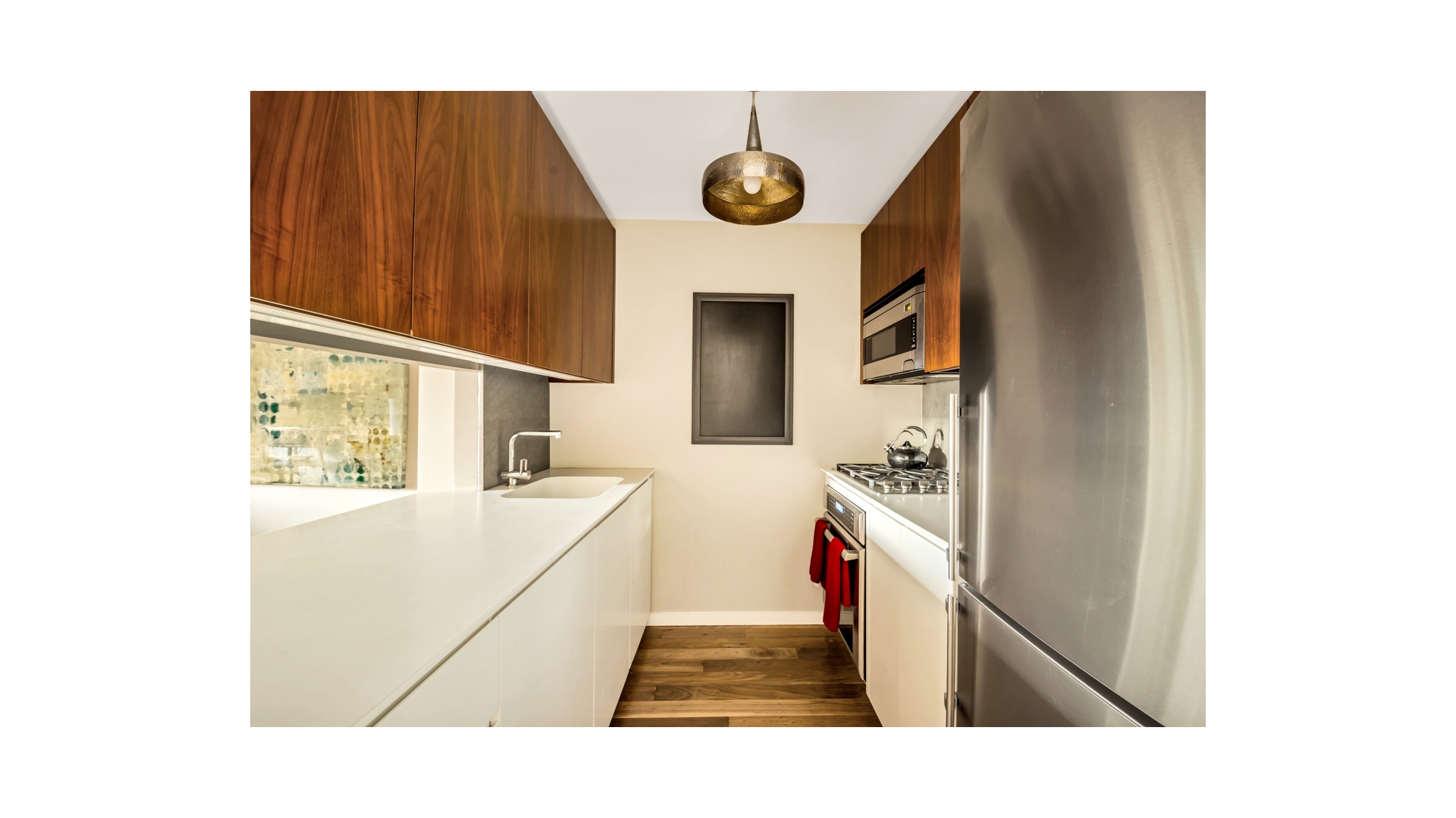 515 East 72nd Street, Unit 15D Manhattan, NY 10021 - Photo 3 of 10 a en suite bathroom with a sink and a mirror