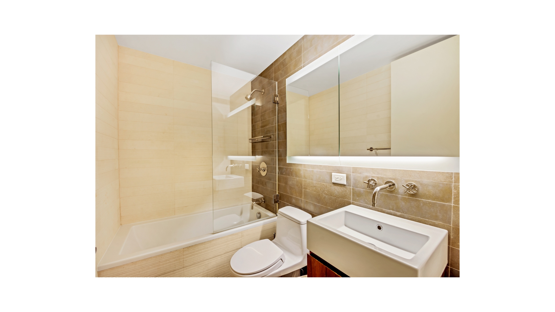 515 East 72nd Street, Unit 15D Manhattan, NY 10021 - Photo 8 of 10 a bathroom with a sink and a mirror