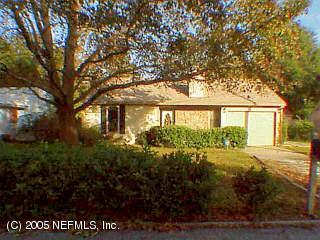 12867 Attrill Road Jacksonville, FL 32258 - Photo 1 of 1 front view of a house with a yard