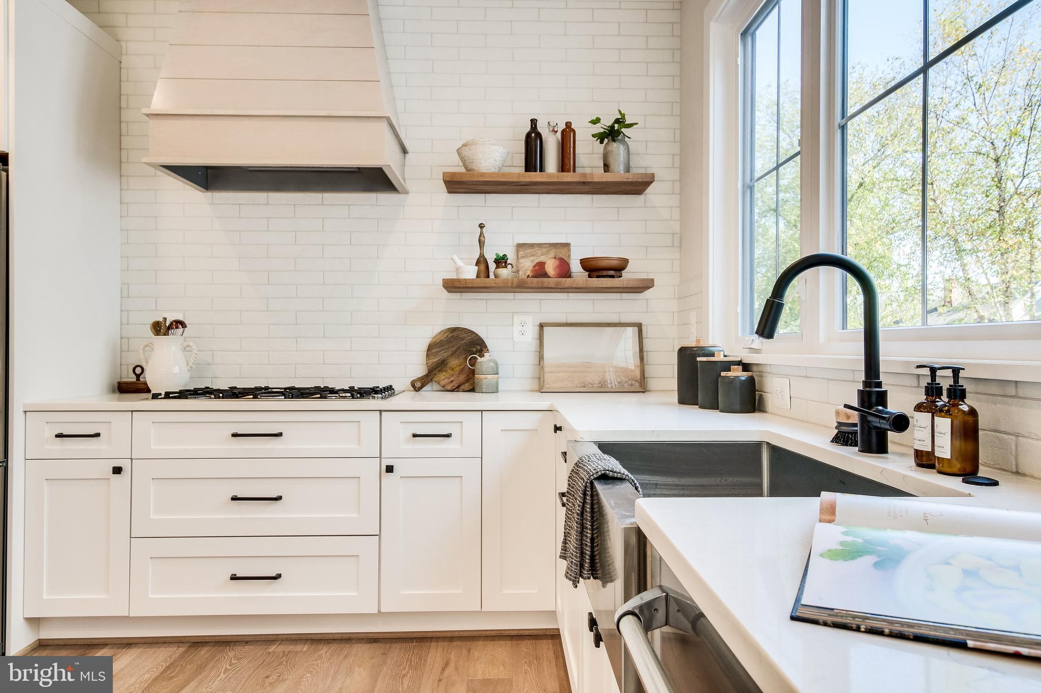 1609 Shenandoah Road Alexandria, VA 22308 - Photo 35 of 102 Farmhouse sink, custom hood & floating shelves