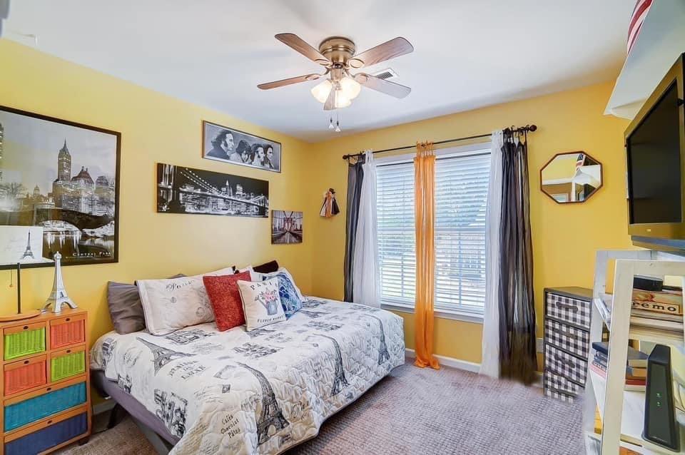 753 Shellstone Place, Unit 87 Fort Mill, SC 29708 - Photo 15 of 21 a bedroom with a bed and a chandelier