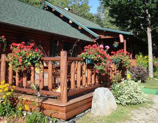 37 Wallingford Road West Forks, ME 04985 - Photo 3 of 12 Exterior Front. Above average log...