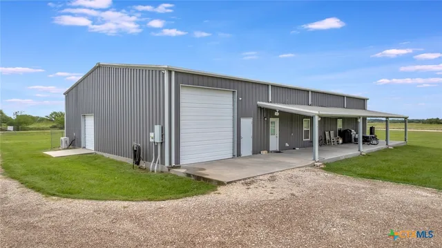 a front view of a house with a garden and porch