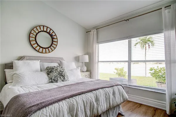 a bathroom with a sink mirror and shower