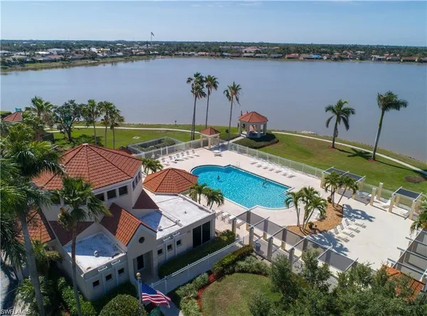 an aerial view of a house with a lake view