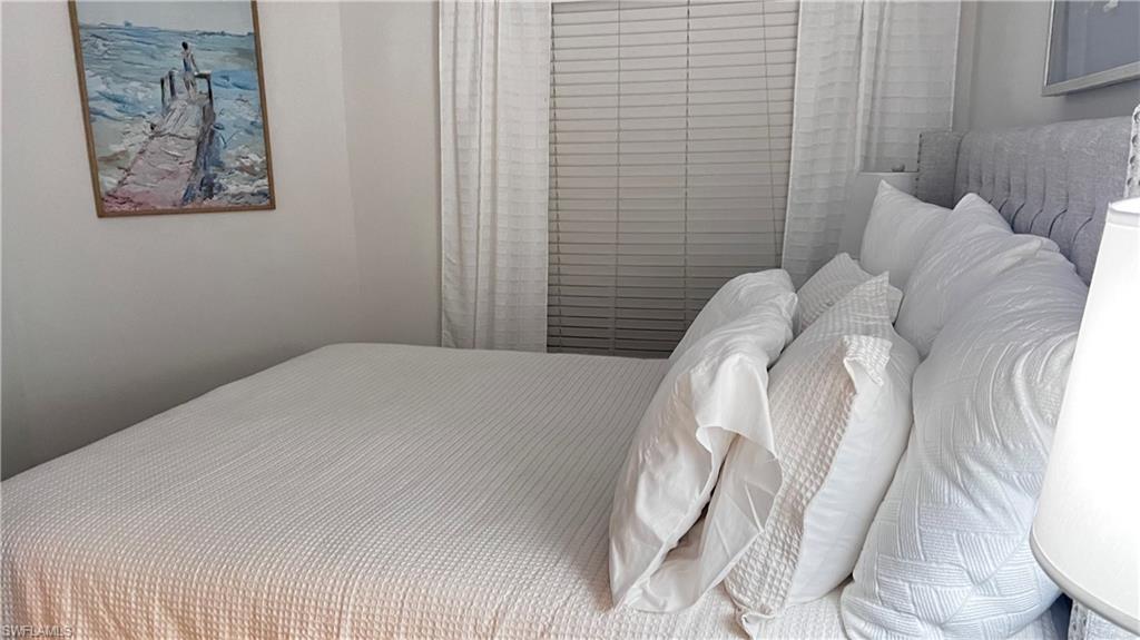 7271 Mill Pond Circle Naples, FL 34109 - Photo 37 of 45 a close up of a white bed in a small room