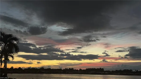 a view of an ocean and city