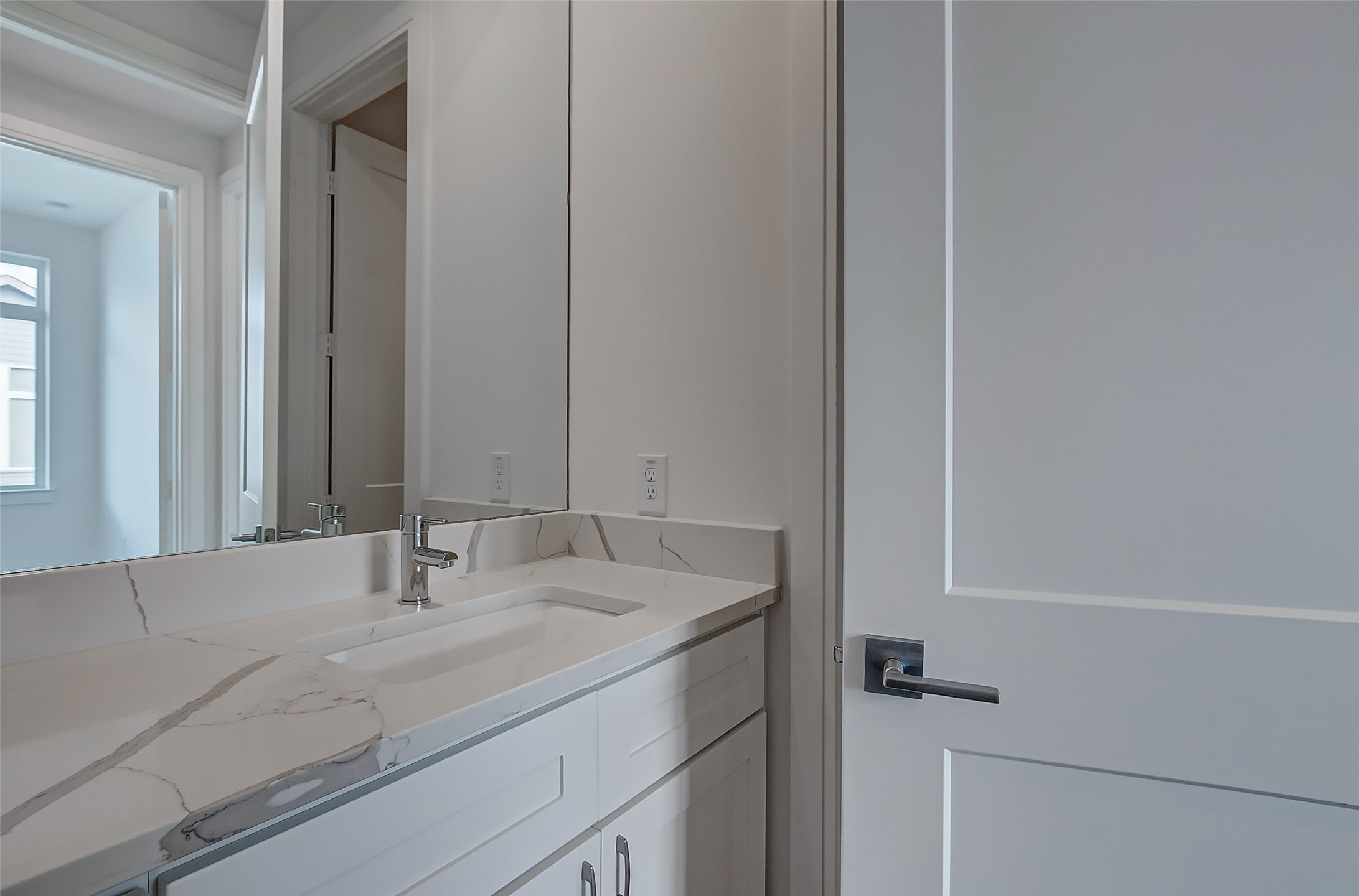 8926 Spring Knoll Forest Drive Houston, TX 77080 - Photo 13 of 22 a bathroom with a sink and a mirror