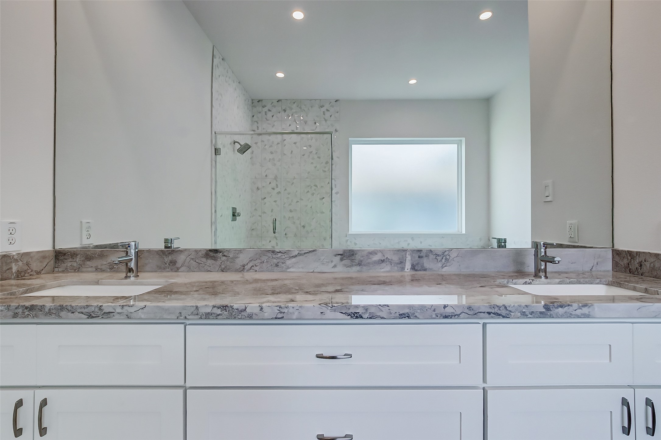 8926 Spring Knoll Forest Drive Houston, TX 77080 - Photo 20 of 22 a bathroom with a granite countertop sink and a mirror