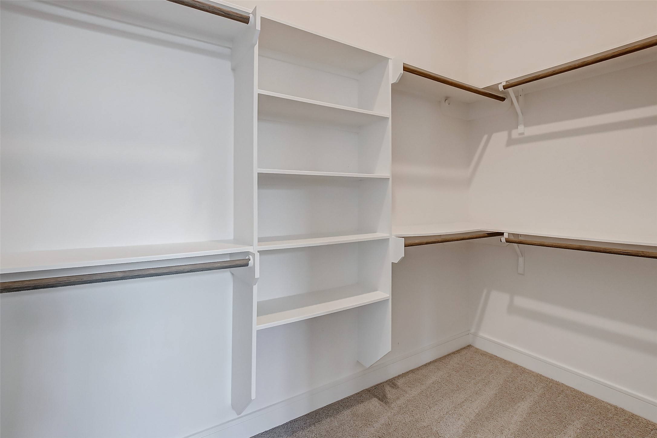 8926 Spring Knoll Forest Drive Houston, TX 77080 - Photo 22 of 22 a view of an empty walk in closet