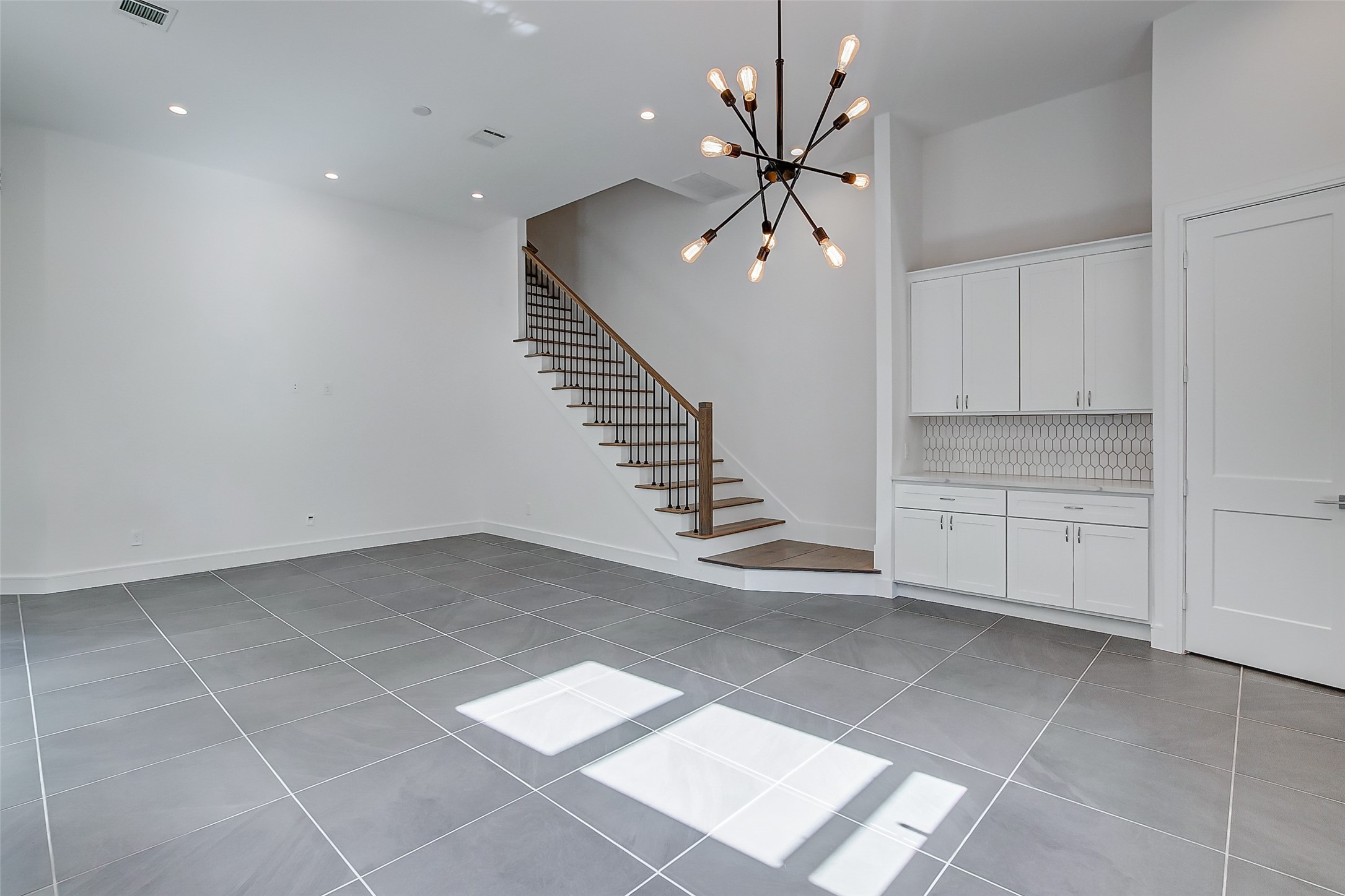 8926 Spring Knoll Forest Drive Houston, TX 77080 - Photo 8 of 22 a view of an empty room with stairs and ventilation
