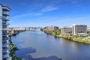 5077 Northwest 7th Street, Unit 1402 Miami, FL 33126 - Photo 1 of 27 a view of a lake with tall buildings