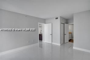 5077 Northwest 7th Street, Unit 1402 Miami, FL 33126 - Photo 12 of 27 a view of a room with an empty space
