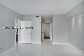 a view of storage and utility room with racks on the wall