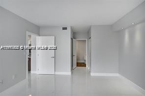 5077 Northwest 7th Street, Unit 1402 Miami, FL 33126 - Photo 13 of 27 a view of an empty room