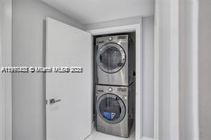 5077 Northwest 7th Street, Unit 1402 Miami, FL 33126 - Photo 22 of 27 a utility room with dryer and washer