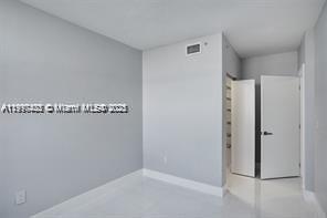 5077 Northwest 7th Street, Unit 1402 Miami, FL 33126 - Photo 24 of 27 a view of a hallway