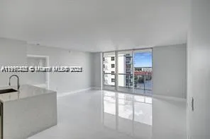 a view of a kitchen and dining room