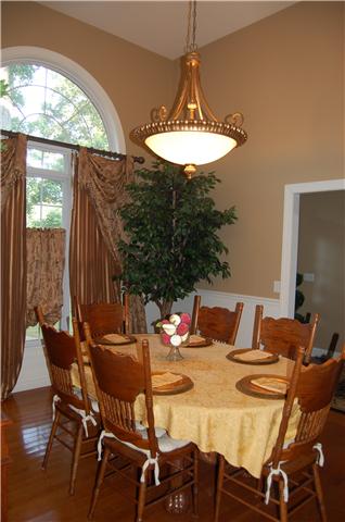 2007 Tamara Court Springfield, TN 37172 - Photo 8 of 20 Stunning dining room with soaring ceiling, wainscoting and window with half round to bring in natural lighting.