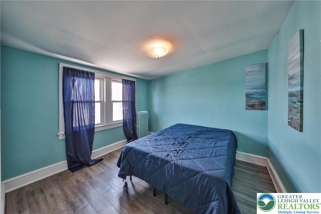 417 3rd Street Lehighton, PA 18235 - Photo 21 of 39 This tranquil bedroom features abundant natural light and durable laminate flooring.