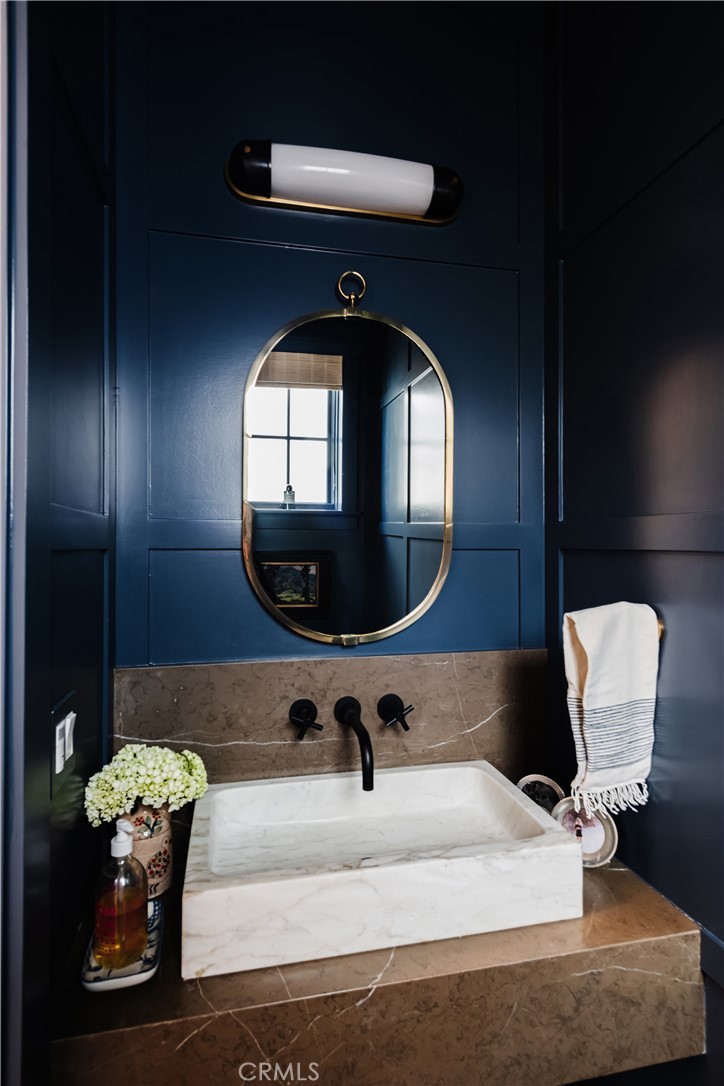 441 3rd Street Manhattan Beach, CA 90266 - Photo 11 of 30 a bathroom with a sink and a mirror