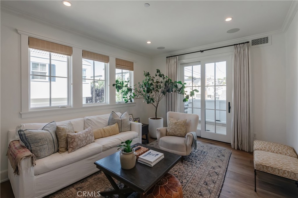 441 3rd Street Manhattan Beach, CA 90266 - Photo 17 of 30 a living room with furniture and a large window