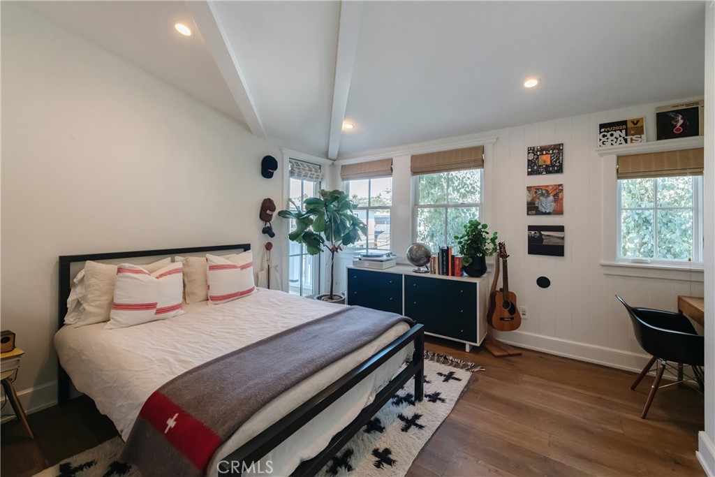 441 3rd Street Manhattan Beach, CA 90266 - Photo 22 of 30 a bedroom with a bed and a table in it