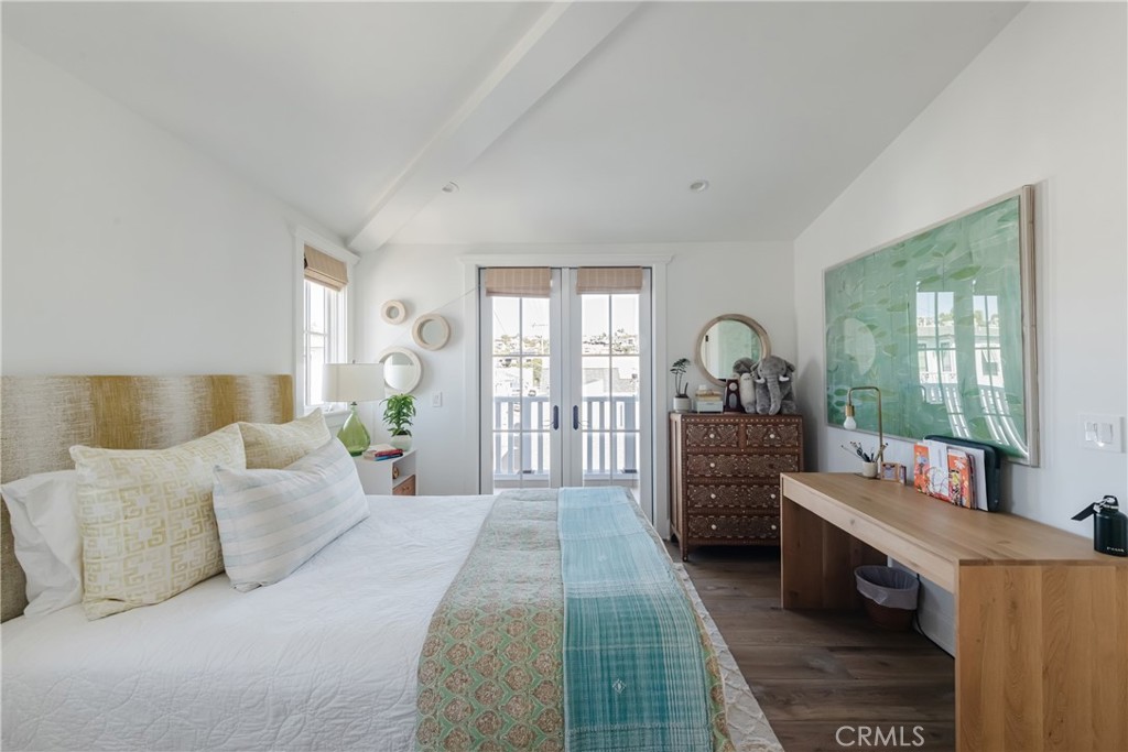 441 3rd Street Manhattan Beach, CA 90266 - Photo 24 of 30 a bedroom with a bed and large windows