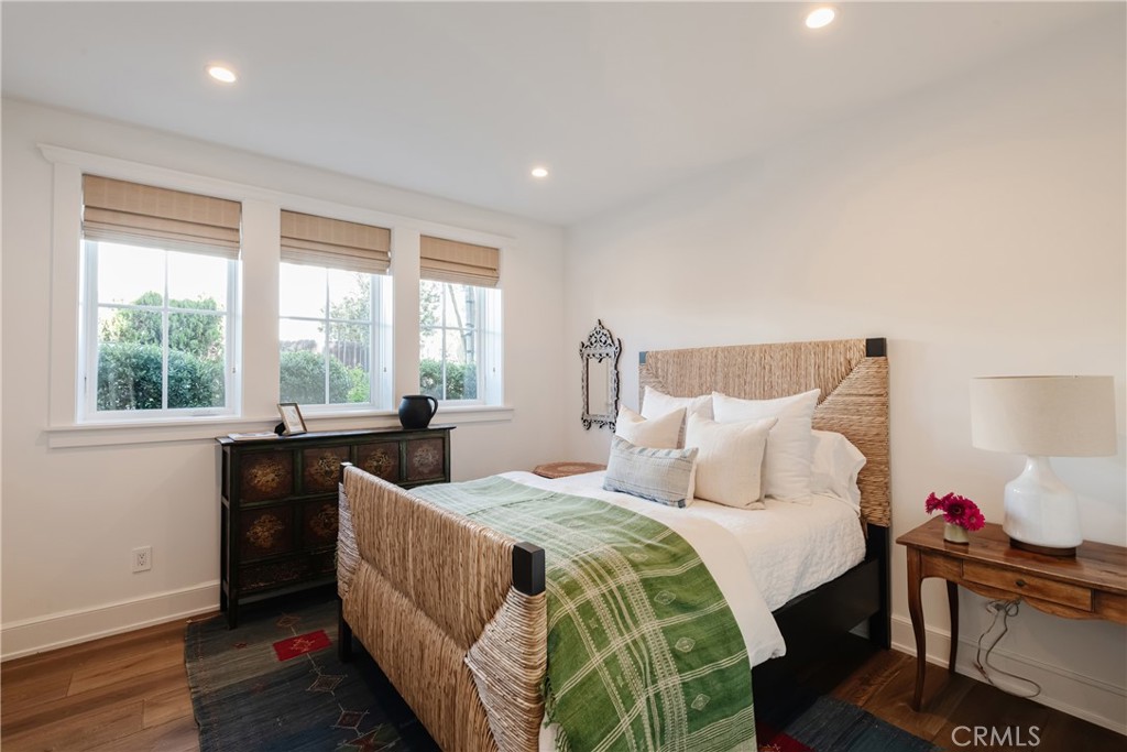 441 3rd Street Manhattan Beach, CA 90266 - Photo 26 of 30 a bedroom with a bed and wooden floor