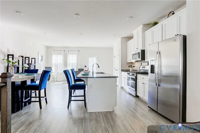 a bathroom with a double vanity sink mirror double vanity tub and shower