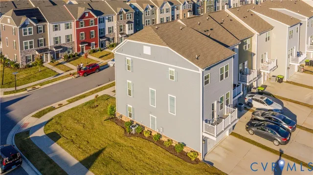 an aerial view of a house with a swimming pool